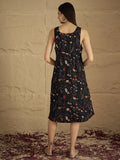 A Sleek Black Floral-Printed Knee-Length Dress With A V-Neckline And Side Slitâ€”Sleeveless, Stylish, And Perfect For Effortless Day-To-Evening Charm.
