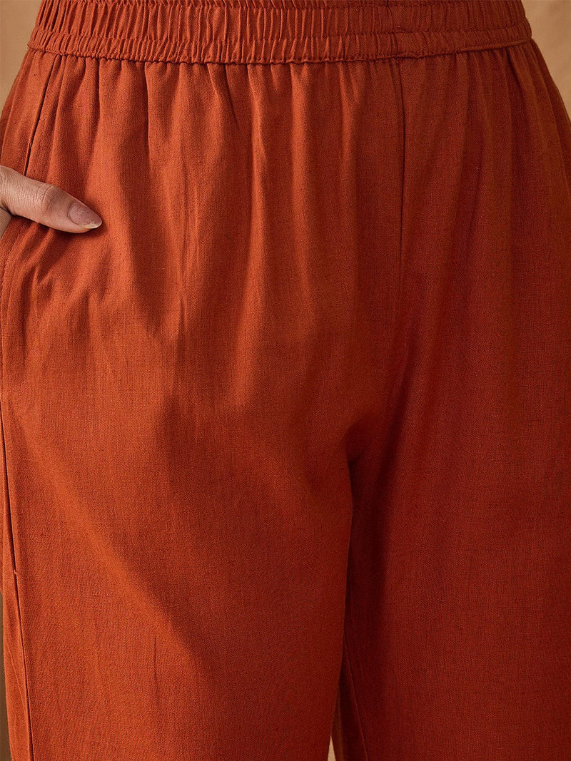 Thread embroidered panelled kurta paired with a pair solid trousers
