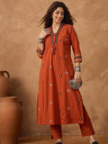 Thread embroidered panelled kurta paired with a pair solid trousers