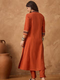 Thread embroidered panelled kurta paired with a pair solid trousers