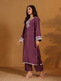 Varanga mauve V-neck yoke embroidered straight kurta with fringes hem paired with tonal bottom and tonal dupatta with fringes