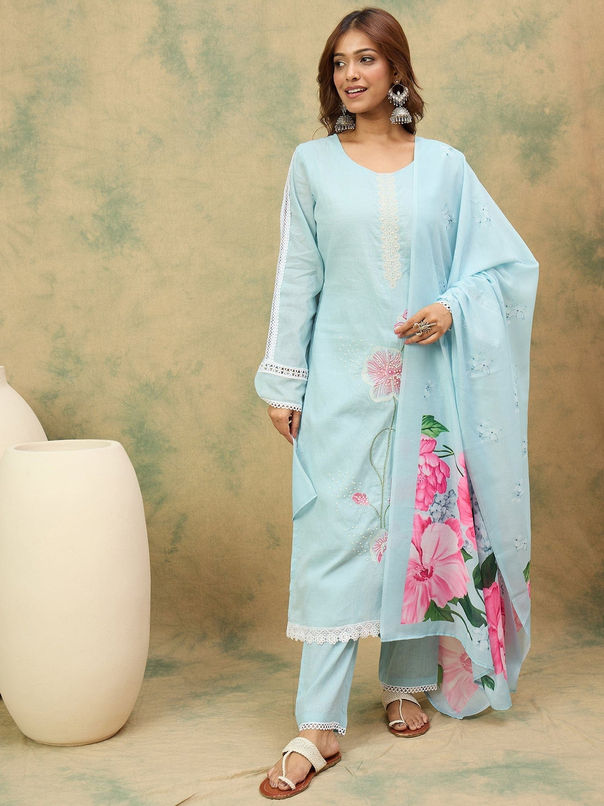 varanga Women A Graceful 3-Piece Set Featuring A Sky Blue Straight-Fit Kurta With Bell Sleeves, Solid Ankle-Length Trousers, And A Floral Printed Dupatta For A Timeless Ethnic Look.
