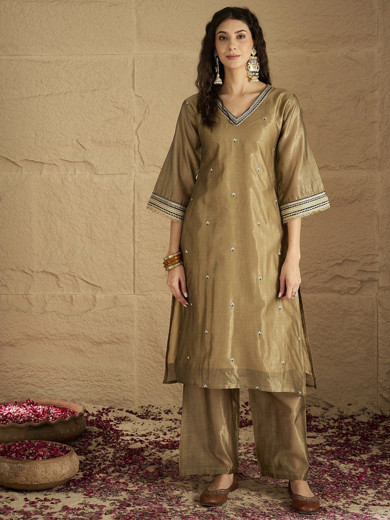 Varanga Women Radiate Festive Charm In This Gold Shimmer Kurta Set With Intricate Lace Detailing, Solid Ankle-Length Trousers, And Printed Dupatta.