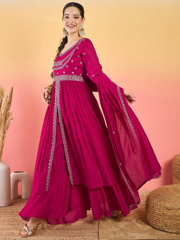 Varanga Fuchsia Anarkali Set Featuring Front-Slit Kurta With Zari-Embroidered Yoke And Border, Paired With A Floor-Length Sharara And A Bordered Dupatta.
