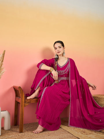 Varanga Fuchsia Anarkali Set Featuring Front-Slit Kurta With Zari-Embroidered Yoke And Border, Paired With A Floor-Length Sharara And A Bordered Dupatta.