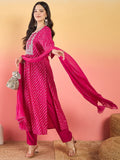 Varanga Bandhani-Printed Fuchsia Anarkali With Zari-Embroidered Yoke, Paired With Solid Trousers And Dupatta .