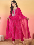 Varanga Bandhani-Printed Fuchsia Anarkali With Zari-Embroidered Yoke, Paired With Solid Trousers And Dupatta .