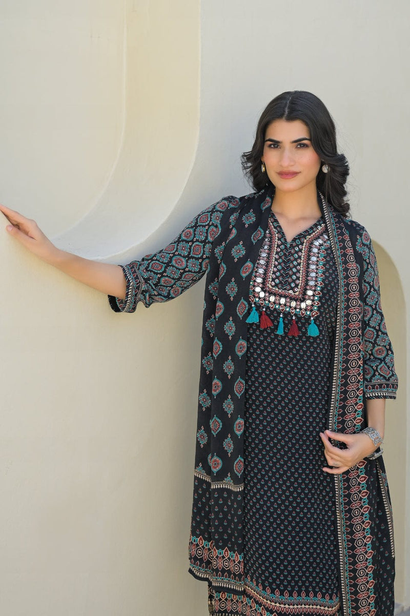 smooth drape of Modal silk with the Varanga Straight Kurta Set. This piece features a captivating black placement print and is distinguished by delicate, textural placement hand embroidery. A matching printed dupatta provides the perfect finishing touch.