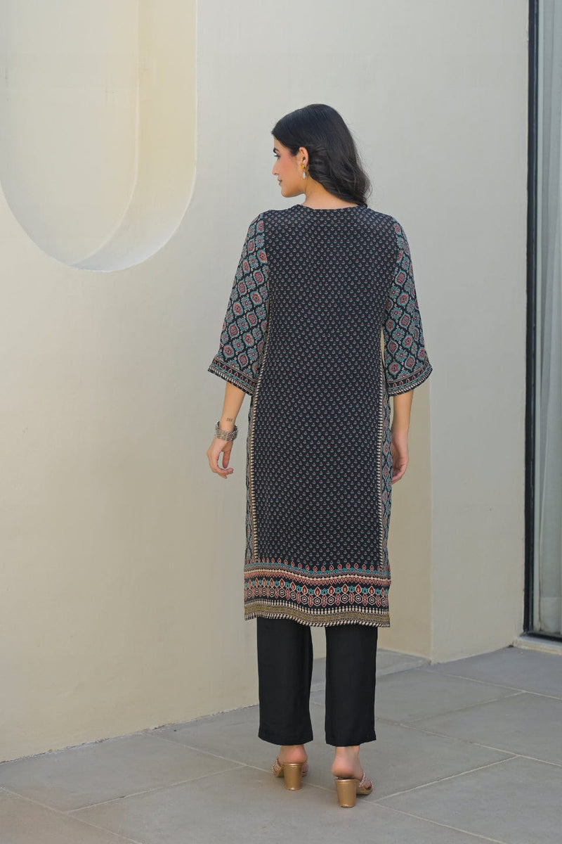 smooth drape of Modal silk with the Varanga Straight Kurta Set. This piece features a captivating black placement print and is distinguished by delicate, textural placement hand embroidery. A matching printed dupatta provides the perfect finishing touch.