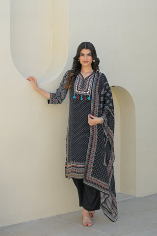 smooth drape of Modal silk with the Varanga Straight Kurta Set. This piece features a captivating black placement print and is distinguished by delicate, textural placement hand embroidery. A matching printed dupatta provides the perfect finishing touch.