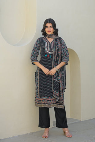 smooth drape of Modal silk with the Varanga Straight Kurta Set. This piece features a captivating black placement print and is distinguished by delicate, textural placement hand embroidery. A matching printed dupatta provides the perfect finishing touch.