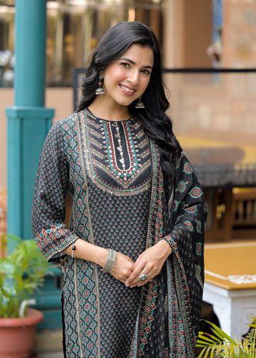 The Varanga Straight Kurta Set is a fusion of comfort and distinctive design. Made from smooth Modal silk, it features a bold black placement print and intricate placement hand embroidery