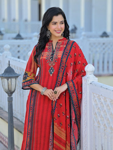 Varanga Women's Modal Silk Straight Kurta Set. This eye-catching set features a rust and blue placement print on Modal silk, complemented by delicate hand embroidery. It is paired with a matching printed dupatta.