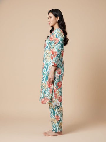 KSUT Women Cream Floral Printed High Low Straight Kurta Paired With Tonal Bottom