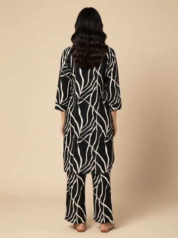KSUT Women Black & White Abstract Printed Straight Kurta Paired With Tonal Printed Bottom