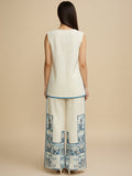 Off-white printed co-ord set featuring a sleeveless V-neck top and relaxed palazzo trousers for a chic, casual look.