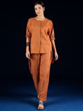Varanga Rust Straight-Fit Shirt With Puff Sleeves And A Round Neck, Paired With Solid Ankle-Length Straight-Fit Trousers.