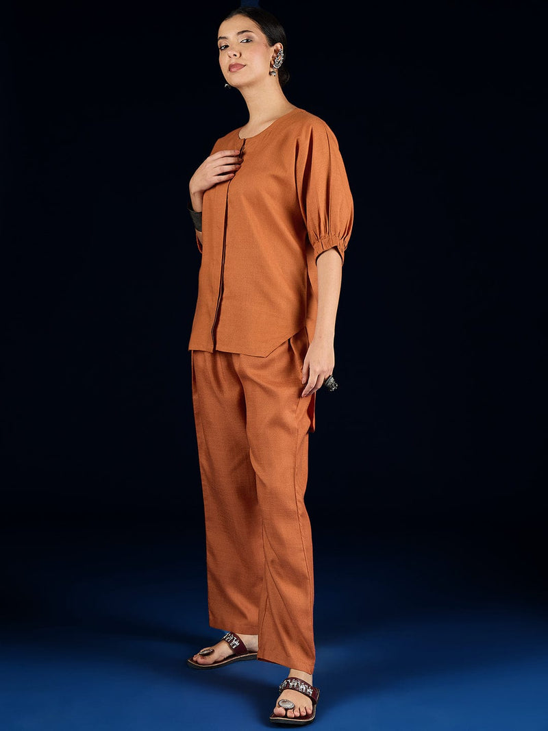Varanga Rust Straight-Fit Shirt With Puff Sleeves And A Round Neck, Paired With Solid Ankle-Length Straight-Fit Trousers.