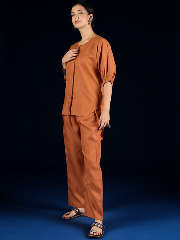 Varanga Rust Straight-Fit Shirt With Puff Sleeves And A Round Neck, Paired With Solid Ankle-Length Straight-Fit Trousers.