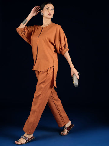Varanga Rust Straight-Fit Shirt With Puff Sleeves And A Round Neck, Paired With Solid Ankle-Length Straight-Fit Trousers.